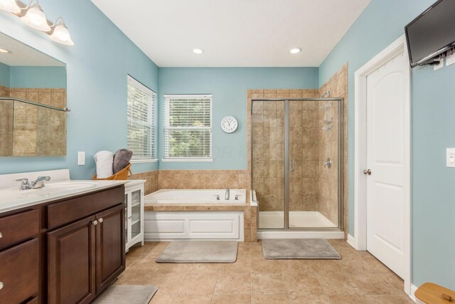 340 Olentangy W, Delaware, OH 43015 - full bath featuring a bath, a shower stall, vanity, tile patterned flooring, and recessed lighting