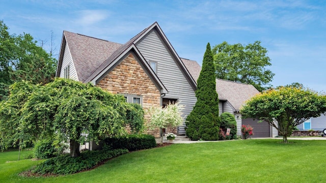 102 Sequoia Dr, Byesville, OH 43723 - view of home's exterior featuring stone siding, a lawn, a shingled roof, and an attached garage