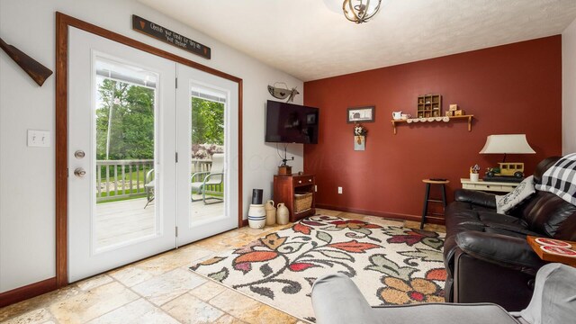 102 Sequoia Dr, Byesville, OH 43723 - living area featuring stone tile flooring and baseboards