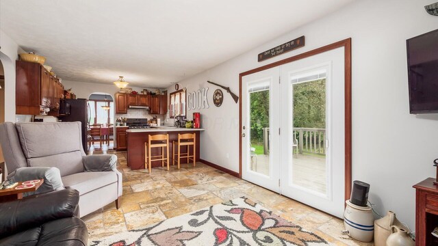 102 Sequoia Dr, Byesville, OH 43723 - living room with stone tile floors and arched walkways