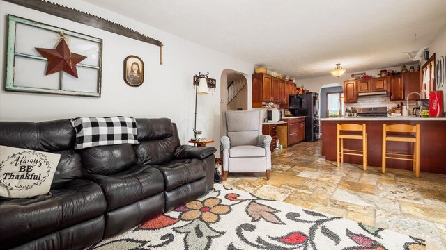 102 Sequoia Dr, Byesville, OH 43723 - living area with arched walkways and stone tile floors