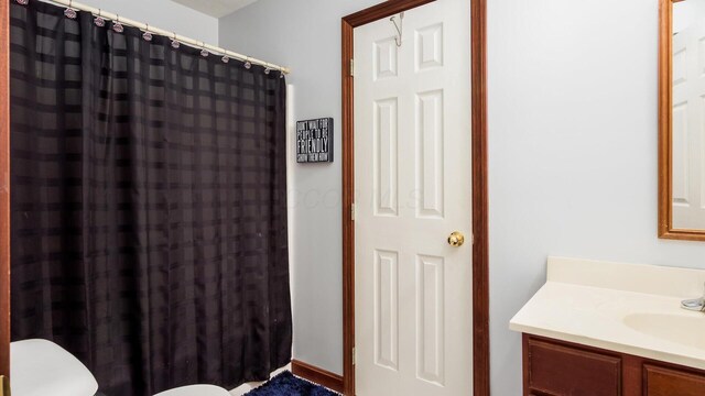 102 Sequoia Dr, Byesville, OH 43723 - full bath featuring toilet, vanity, and a shower with shower curtain