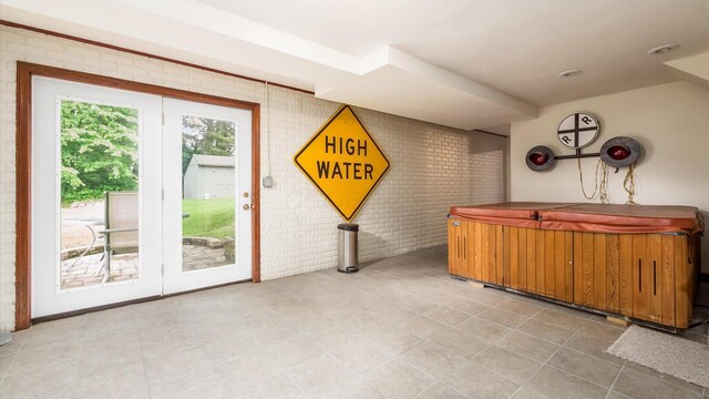 102 Sequoia Dr, Byesville, OH 43723 - interior space with light tile patterned flooring and brick wall