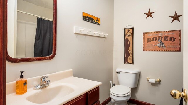 102 Sequoia Dr, Byesville, OH 43723 - full bath with vanity, toilet, and a shower with shower curtain