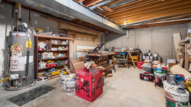 102 Sequoia Dr, Byesville, OH 43723 - unfinished below grade area featuring water heater and a workshop area