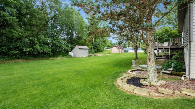102 Sequoia Dr, Byesville, OH 43723 - view of green lawn with stairs and a wooden deck