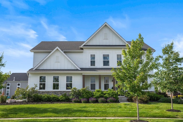 8318 Fig Grove Way, Plain City, OH 43064 - view of front of house with board and batten siding, a front lawn, a porch, and a shingled roof
