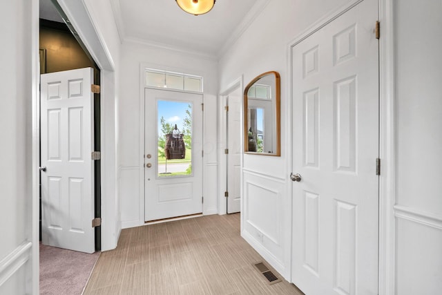 8318 Fig Grove Way, Plain City, OH 43064 - entryway with ornamental molding and light carpet