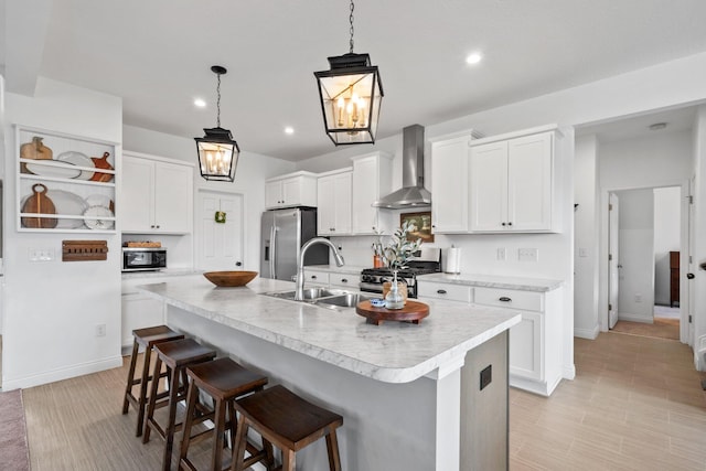 8318 Fig Grove Way, Plain City, OH 43064 - kitchen featuring wall chimney exhaust hood, appliances with stainless steel finishes, open shelves, a sink, and a breakfast bar