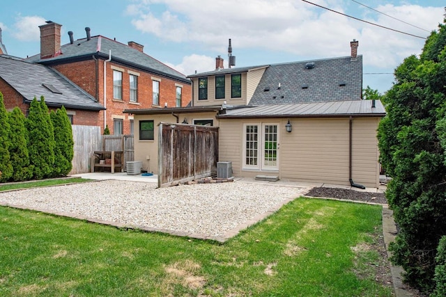 717 S 3rd St, Columbus, OH 43206 - rear view of property featuring a standing seam roof, a patio, a metal roof, and a chimney