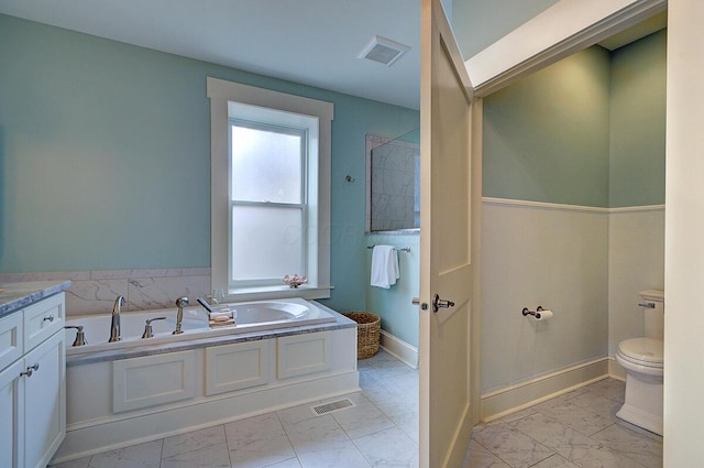 717 S 3rd St, Columbus, OH 43206 - bathroom with marble finish floors, a bath, and vanity