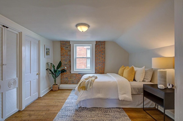 717 S 3rd St, Columbus, OH 43206 - bedroom featuring wood finished floors and vaulted ceiling