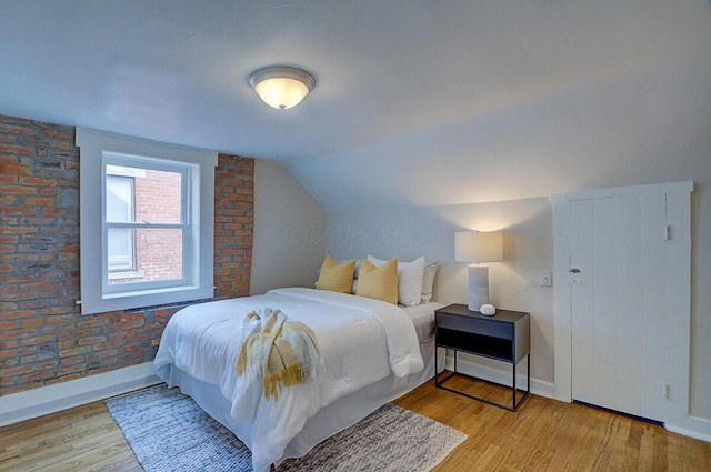 717 S 3rd St, Columbus, OH 43206 - bedroom featuring wood finished floors and lofted ceiling