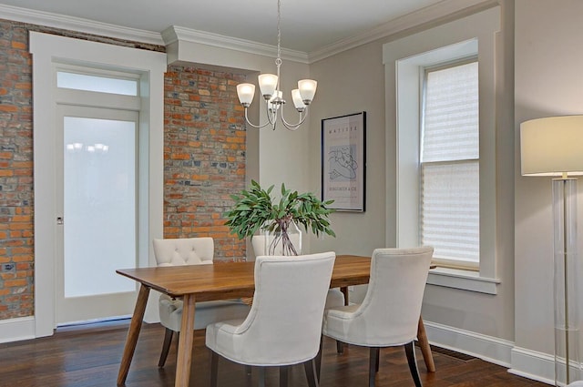 717 S 3rd St, Columbus, OH 43206 - dining space with dark wood-style floors, a chandelier, and ornamental molding