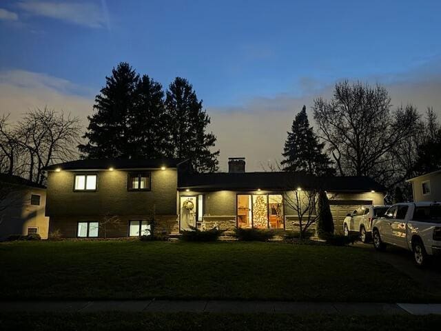 1805 Millwood Dr, Columbus, OH 43221 - split level home featuring a front yard and a chimney