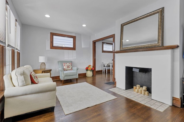 1442 S 4th St, Columbus, OH 43207 - living area with a fireplace with flush hearth, wood finished floors, recessed lighting, and baseboards