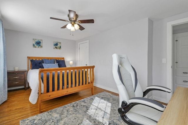 1442 S 4th St, Columbus, OH 43207 - bedroom with wood finished floors, baseboards, and a ceiling fan