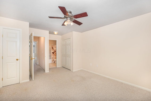 5145 Vinings Blvd Unit B, Dublin, OH 43016 - unfurnished bedroom with light colored carpet, baseboards, ensuite bath, and a ceiling fan