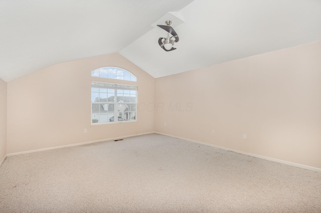 5145 Vinings Blvd Unit B, Dublin, OH 43016 - additional living space with vaulted ceiling, light colored carpet, and baseboards