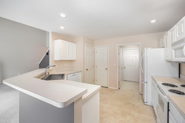 5145 Vinings Blvd Unit B, Dublin, OH 43016 - kitchen with a sink, white appliances, light countertops, recessed lighting, and white cabinetry