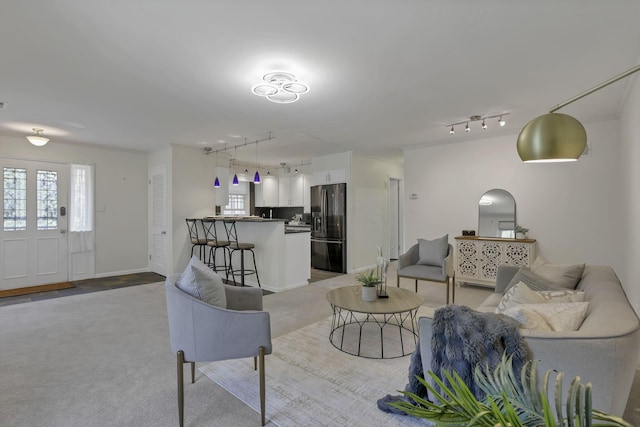 1631 Roxbury Rd Unit B6, Columbus, OH 43212 - living room featuring rail lighting and carpet flooring