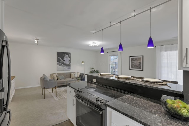 1631 Roxbury Rd Unit B6, Columbus, OH 43212 - kitchen featuring range with electric cooktop, white cabinets, dark stone countertops, freestanding refrigerator, and open floor plan