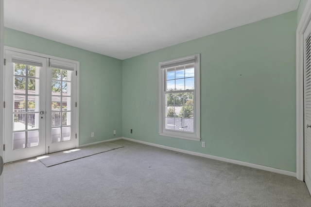 1631 Roxbury Rd Unit B6, Columbus, OH 43212 - carpeted empty room featuring healthy amount of natural light, baseboards, and french doors