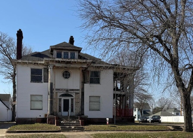 615 S Court St, Circleville, OH 43113 - view of front of property with a chimney and a front yard