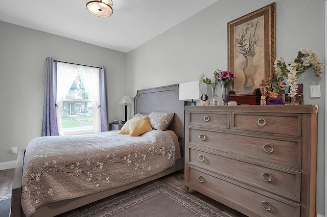 244 Shepper Ave, Plain City, OH 43064 - bedroom featuring baseboards and dark wood-style flooring