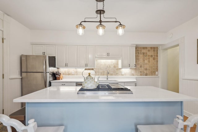 436 Beck St, Columbus, OH 43206 - kitchen featuring appliances with stainless steel finishes, a sink, white cabinetry, and light countertops