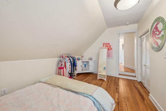 436 Beck St, Columbus, OH 43206 - bedroom with lofted ceiling, wood finished floors, and baseboards