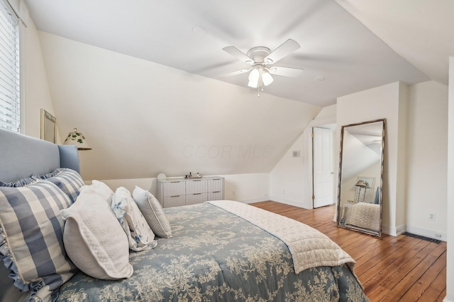 436 Beck St, Columbus, OH 43206 - bedroom featuring wood finished floors, vaulted ceiling, baseboards, and a ceiling fan