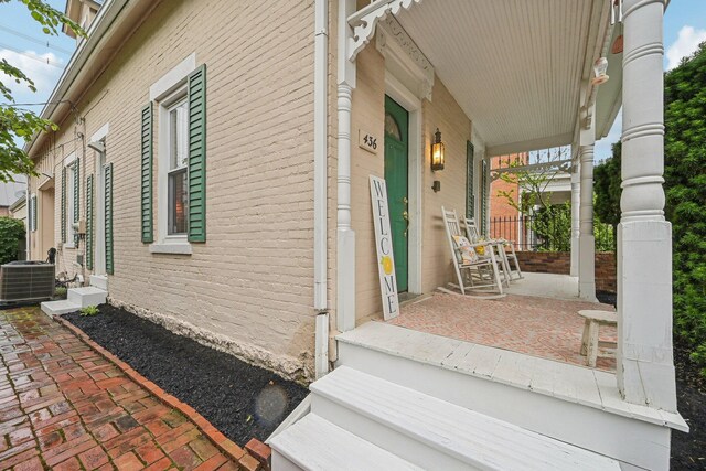 436 Beck St, Columbus, OH 43206 - view of home's exterior featuring a porch, central air condition unit, and brick siding
