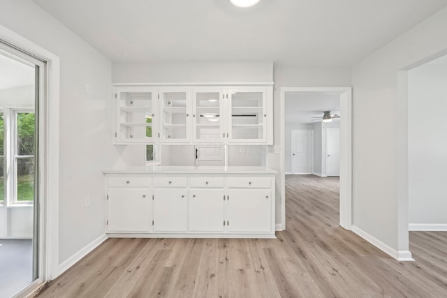 106 Woodrow Ave, Delaware, OH 43015 - unfurnished dining area featuring light wood finished floors, baseboards, and ceiling fan
