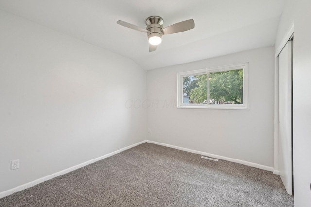 106 Woodrow Ave, Delaware, OH 43015 - unfurnished bedroom with carpet floors, a closet, baseboards, vaulted ceiling, and ceiling fan
