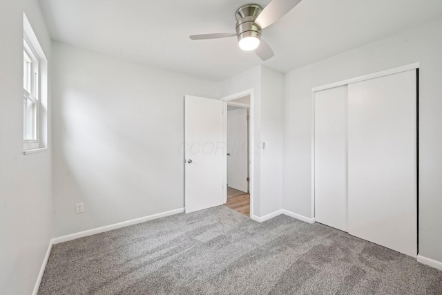 106 Woodrow Ave, Delaware, OH 43015 - unfurnished bedroom featuring carpet floors, baseboards, a closet, and a ceiling fan