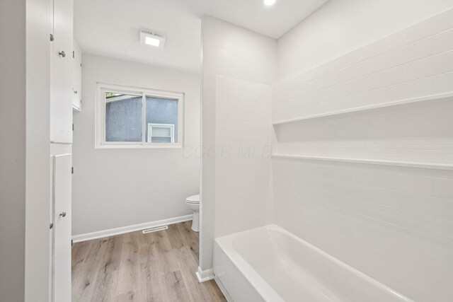 106 Woodrow Ave, Delaware, OH 43015 - full bathroom featuring toilet, wood finished floors, and baseboards