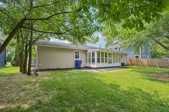 106 Woodrow Ave, Delaware, OH 43015 - rear view of house featuring a sunroom