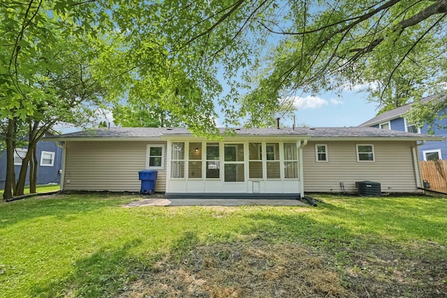 106 Woodrow Ave, Delaware, OH 43015 - back of house with a sunroom and central AC unit