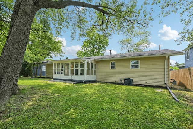 106 Woodrow Ave, Delaware, OH 43015 - back of property with a sunroom and cooling unit