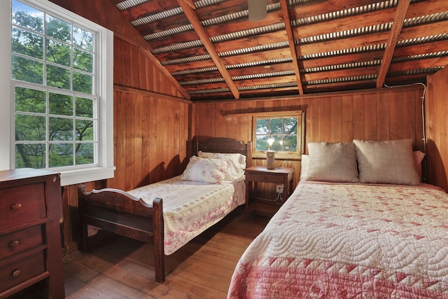 3381/2 16th St, Lancaster, OH 43130 - bedroom featuring wooden walls, multiple windows, wooden ceiling, and hardwood / wood-style flooring
