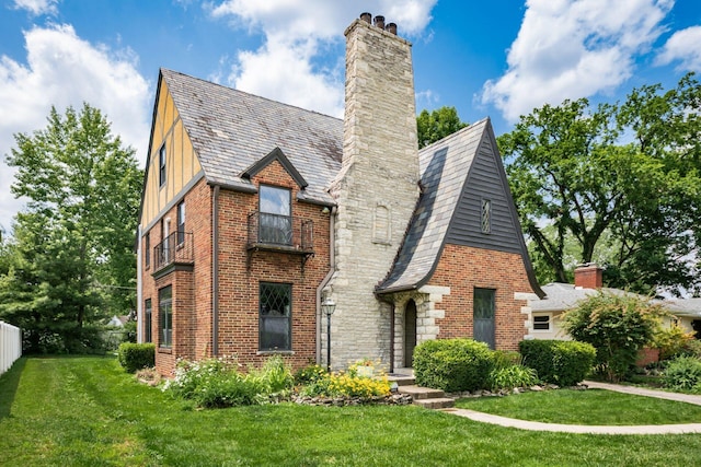 141 S Kellner Rd, Columbus, OH 43209 - tudor house featuring a chimney, a high end roof, and brick siding