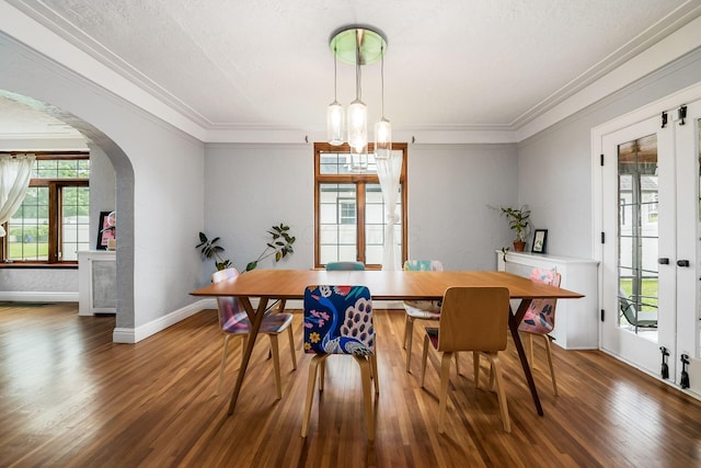 141 S Kellner Rd, Columbus, OH 43209 - dining room featuring arched walkways, wood finished floors, crown molding, a chandelier, and french doors