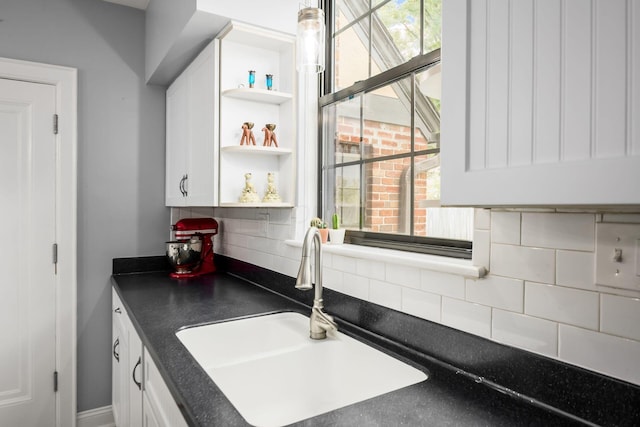 141 S Kellner Rd, Columbus, OH 43209 - kitchen with dark countertops, tasteful backsplash, white cabinetry, and open shelves