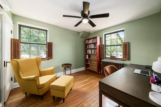 141 S Kellner Rd, Columbus, OH 43209 - office featuring radiator heating unit, plenty of natural light, wood finished floors, and a ceiling fan