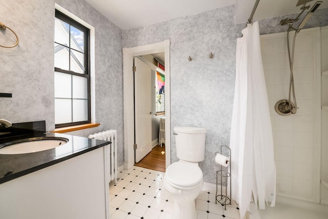 141 S Kellner Rd, Columbus, OH 43209 - full bathroom featuring radiator heating unit, curtained shower, wallpapered walls, vanity, and tile patterned floors