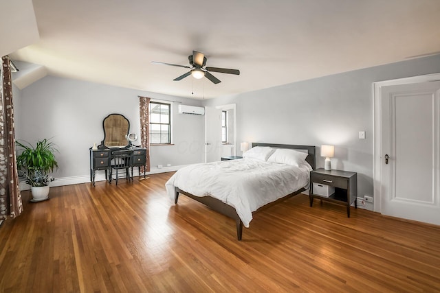 141 S Kellner Rd, Columbus, OH 43209 - bedroom featuring a wall mounted AC, wood finished floors, and ceiling fan