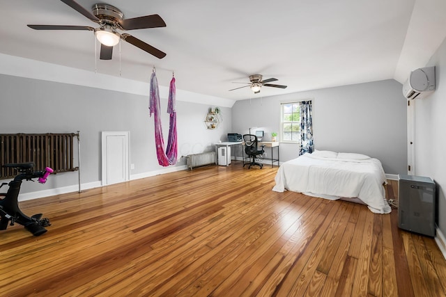 141 S Kellner Rd, Columbus, OH 43209 - bedroom with a wall mounted AC, radiator, an office area, hardwood / wood-style flooring, and vaulted ceiling