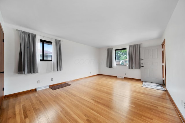 1345 Molly Ln, Columbus, OH 43207 - unfurnished living room featuring light wood-style floors