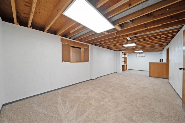 1345 Molly Ln, Columbus, OH 43207 - finished basement with light carpet and concrete block wall